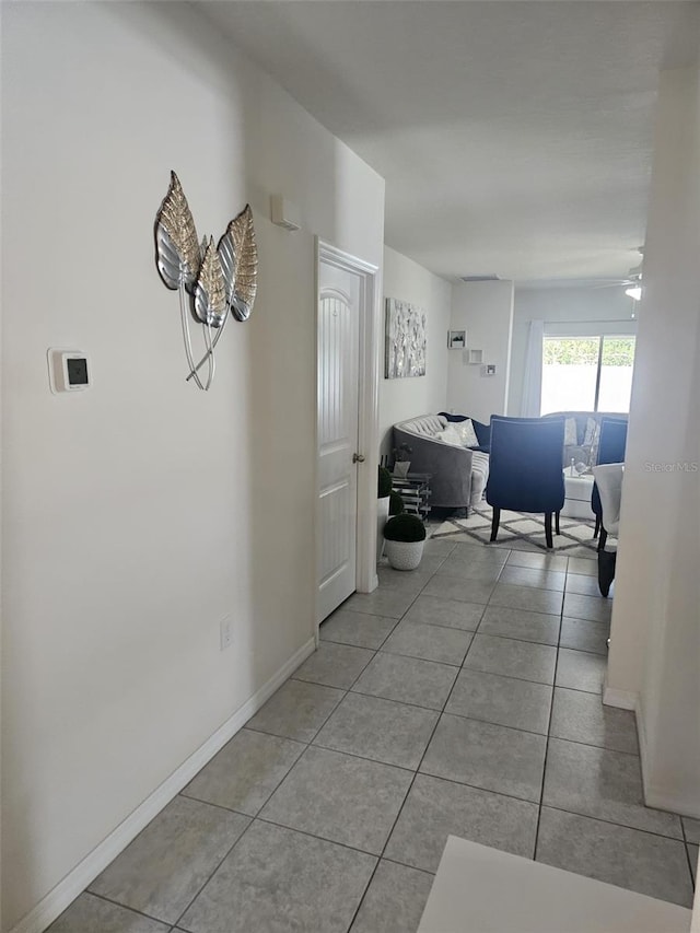 hall featuring light tile floors