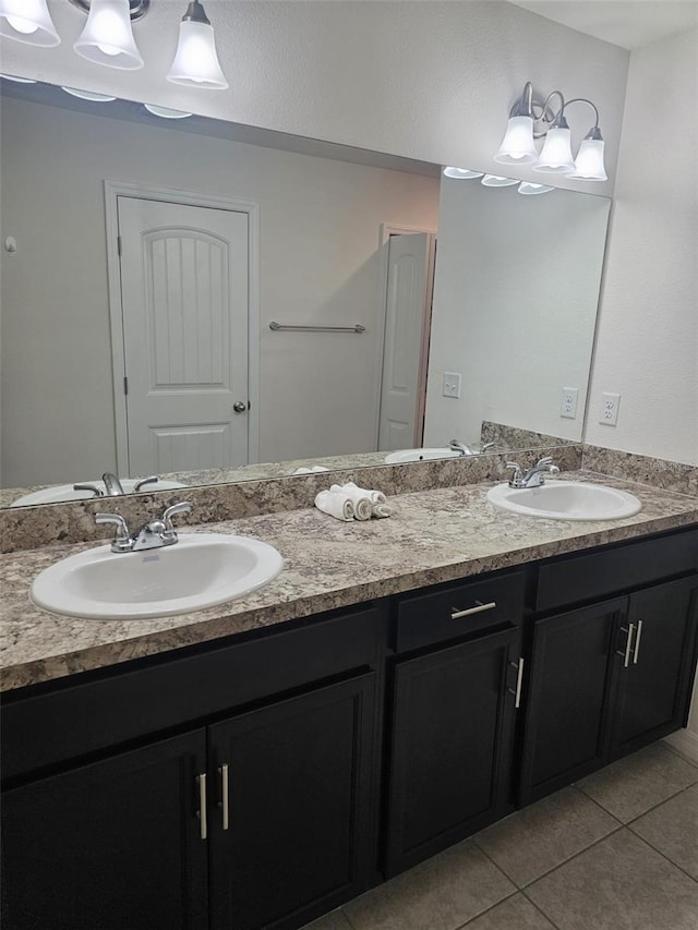 bathroom featuring double vanity and tile floors