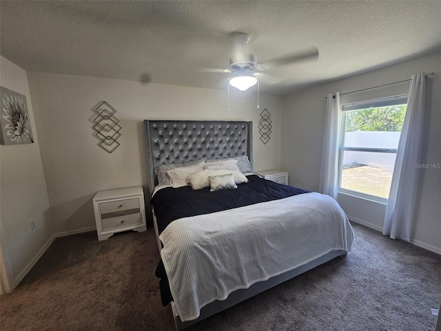 carpeted bedroom with ceiling fan and a textured ceiling