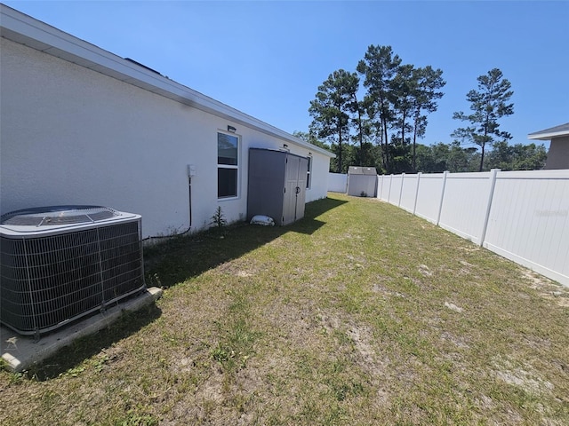 view of yard featuring central air condition unit