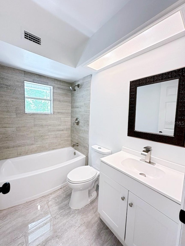 full bathroom featuring vanity, toilet, and tiled shower / bath