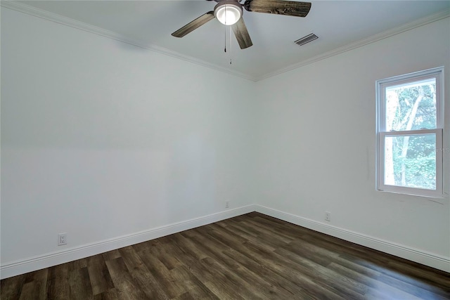 empty room featuring ceiling fan, ornamental molding, and dark hardwood / wood-style flooring