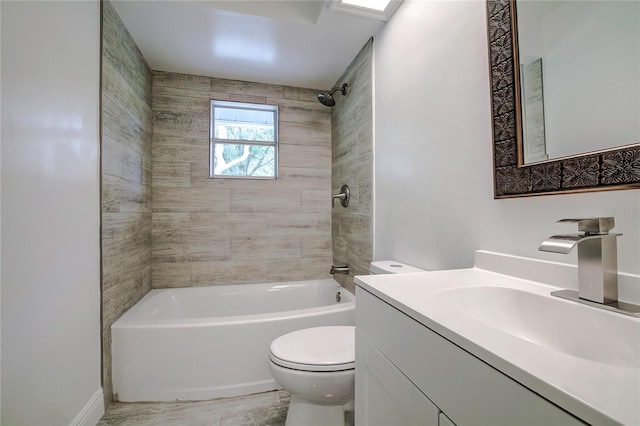 full bathroom featuring vanity, toilet, and tiled shower / bath