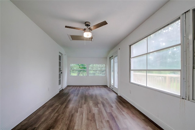 unfurnished room featuring ceiling fan, dark hardwood / wood-style flooring, and lofted ceiling