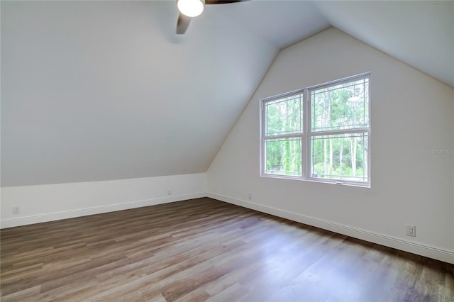 bonus room with ceiling fan, hardwood / wood-style floors, and lofted ceiling