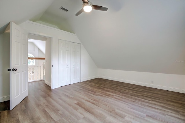 bonus room with ceiling fan, light hardwood / wood-style floors, and lofted ceiling