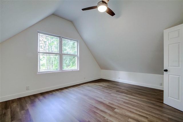 additional living space featuring hardwood / wood-style flooring, ceiling fan, and lofted ceiling