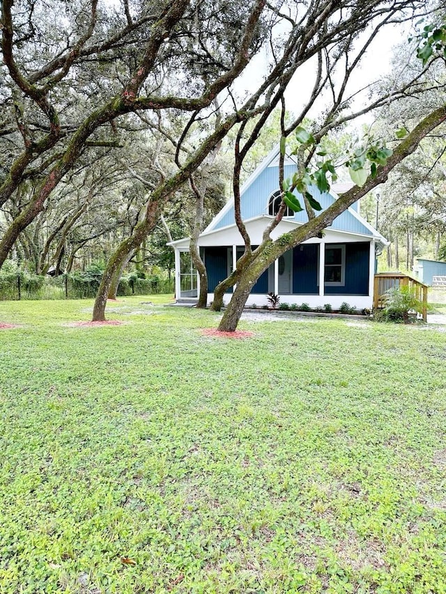 view of yard featuring a sunroom