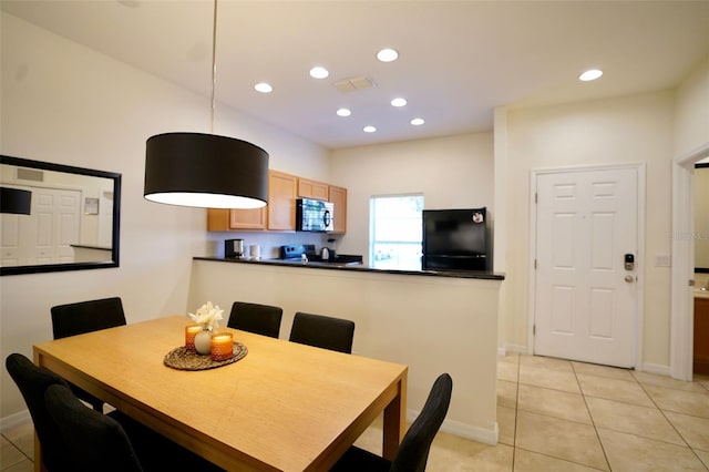 dining room with light tile flooring