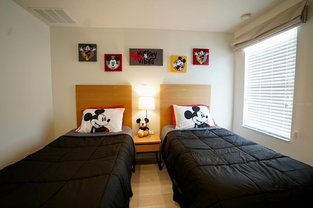 bedroom featuring hardwood / wood-style floors