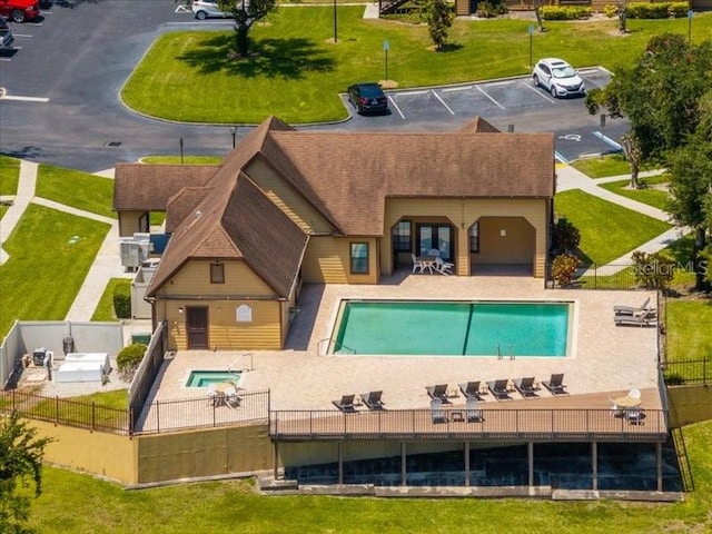 view of pool featuring a patio area and a yard