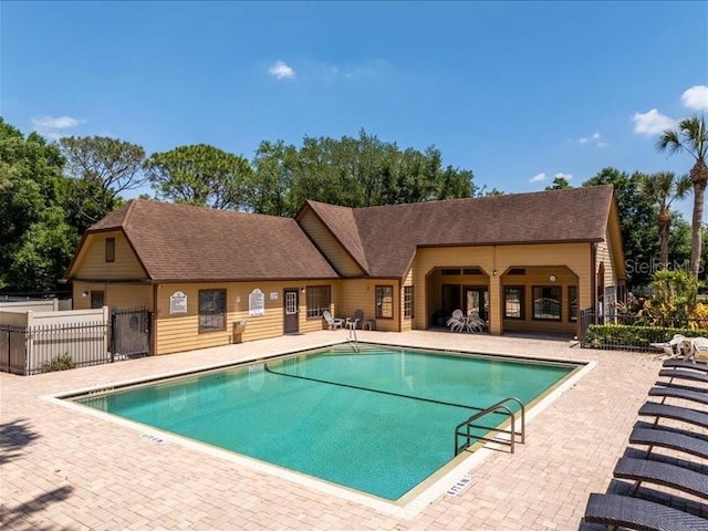 view of swimming pool featuring a patio area