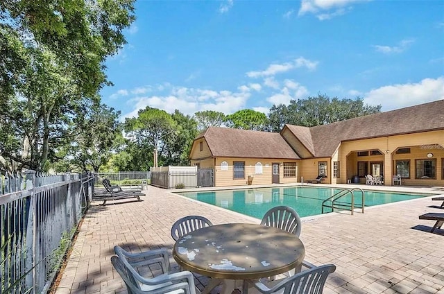 view of swimming pool with a patio area