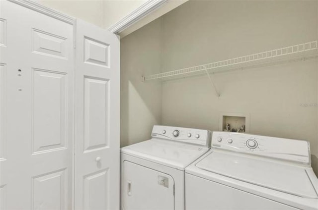 laundry area featuring hookup for a washing machine and washer and dryer