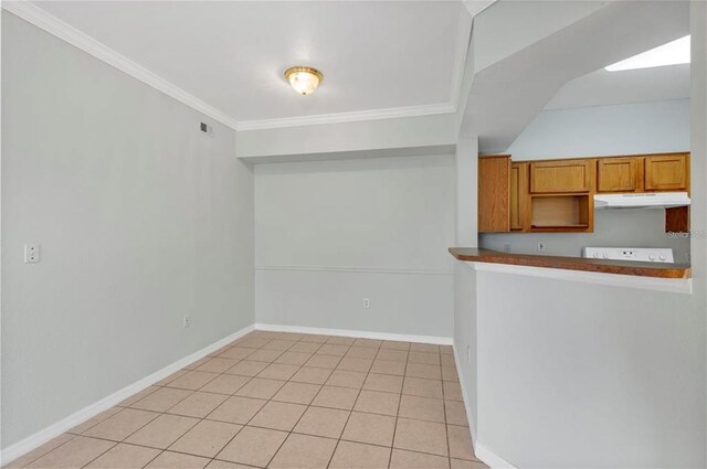 interior space featuring crown molding and light tile flooring