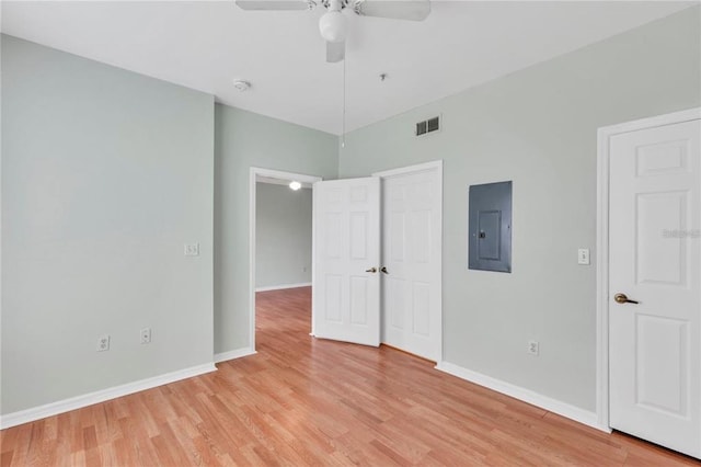 unfurnished bedroom with ceiling fan and light wood-type flooring