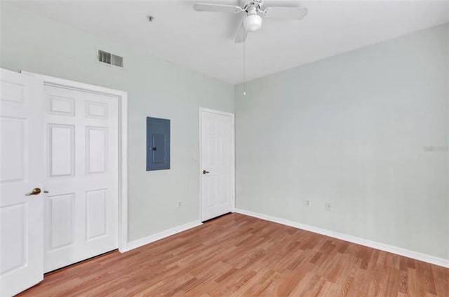 unfurnished bedroom featuring a closet, light hardwood / wood-style flooring, and ceiling fan