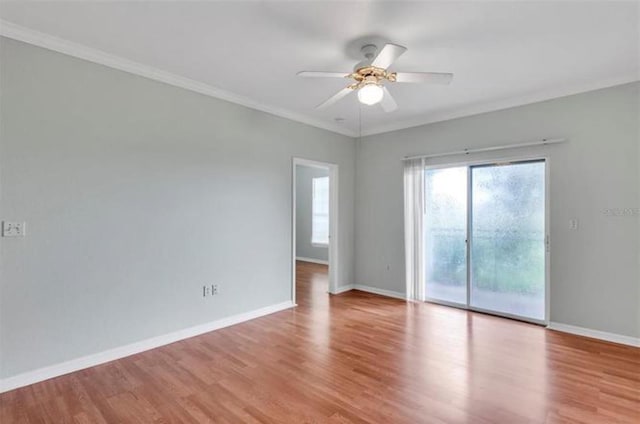 spare room featuring ceiling fan, hardwood / wood-style flooring, and ornamental molding