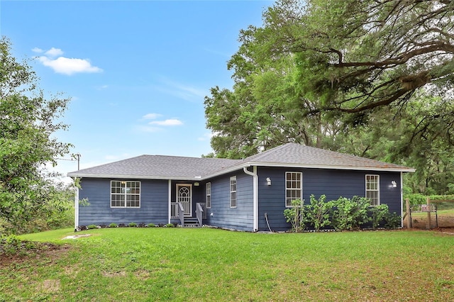 ranch-style house featuring a front lawn