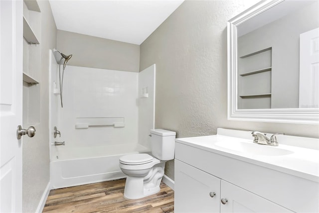 full bathroom with vanity, hardwood / wood-style flooring, shower / bathing tub combination, and toilet