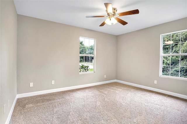 empty room featuring carpet and ceiling fan