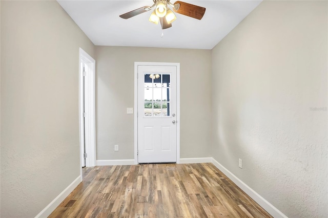 foyer featuring hardwood / wood-style flooring and ceiling fan