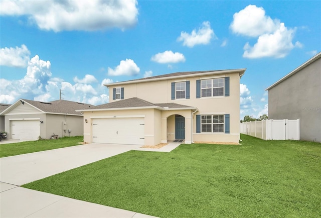 view of property with a garage and a front lawn