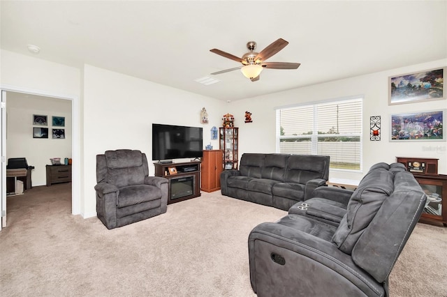 living room featuring ceiling fan and carpet floors