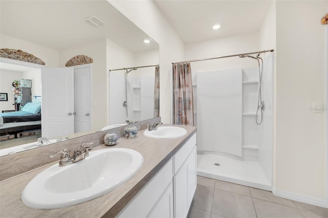 bathroom featuring dual sinks, curtained shower, tile flooring, and large vanity