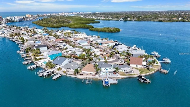 drone / aerial view featuring a residential view and a water view