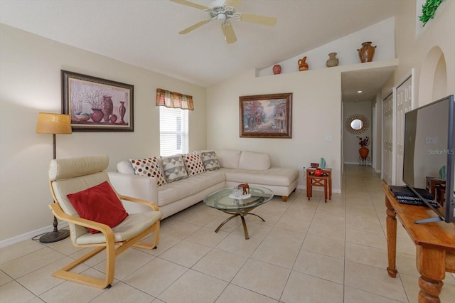 living room with ceiling fan, light tile floors, and lofted ceiling