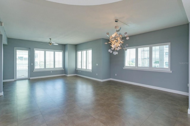 spare room with ceiling fan and tile floors