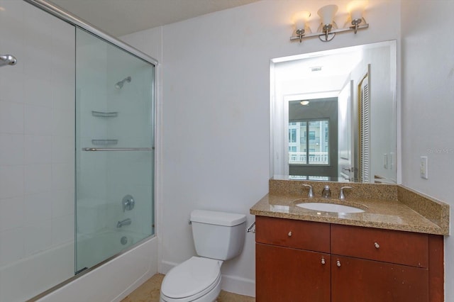 full bathroom featuring shower / bath combination with glass door, vanity, and toilet