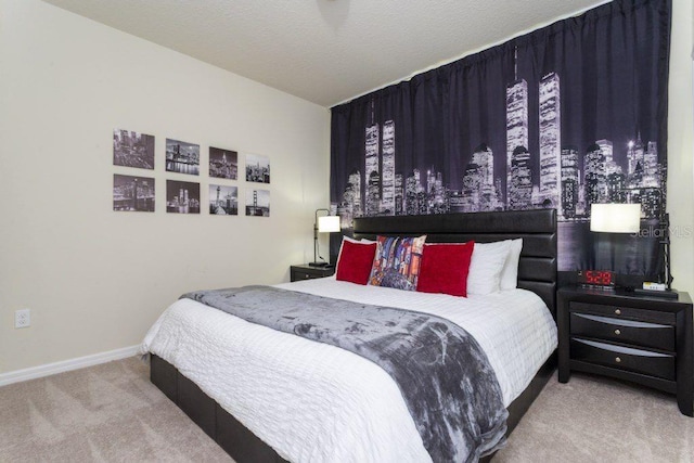 bedroom featuring light carpet