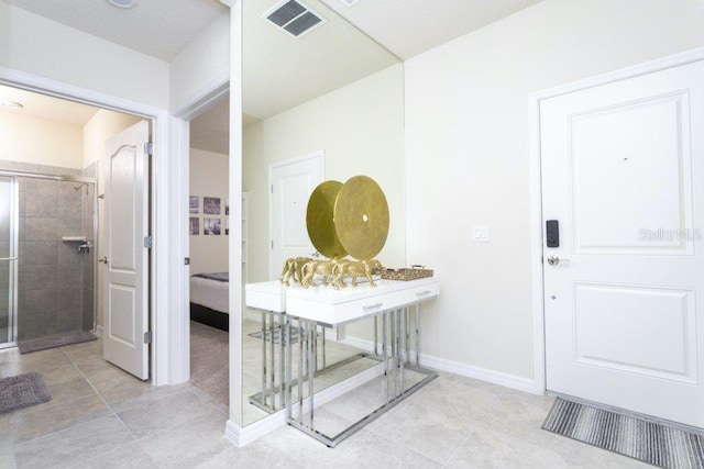 entrance foyer with light tile floors