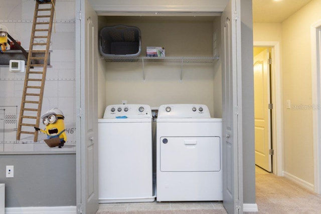 laundry area with light colored carpet, hookup for a washing machine, and washer and clothes dryer