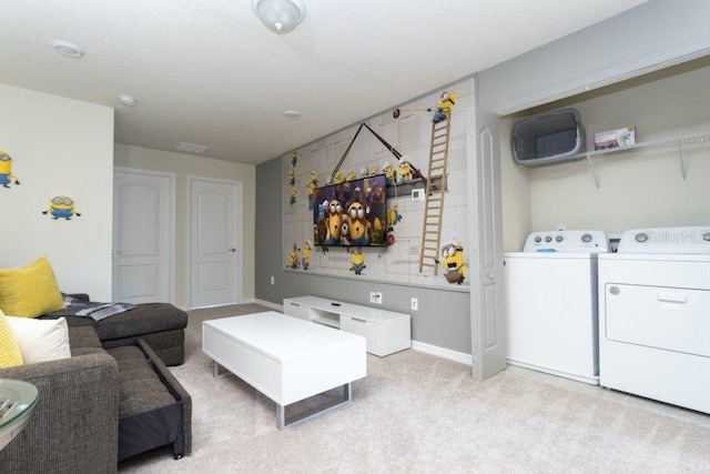 living room with light carpet and washing machine and clothes dryer