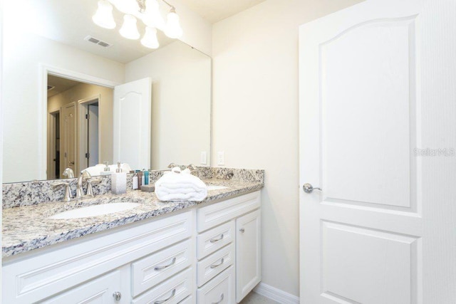 bathroom with oversized vanity and double sink