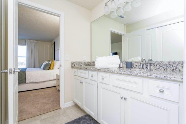 bathroom featuring vanity and tile flooring