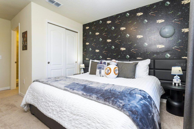 bedroom featuring a closet and carpet floors