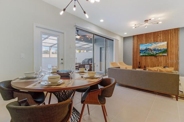 dining space featuring light tile floors