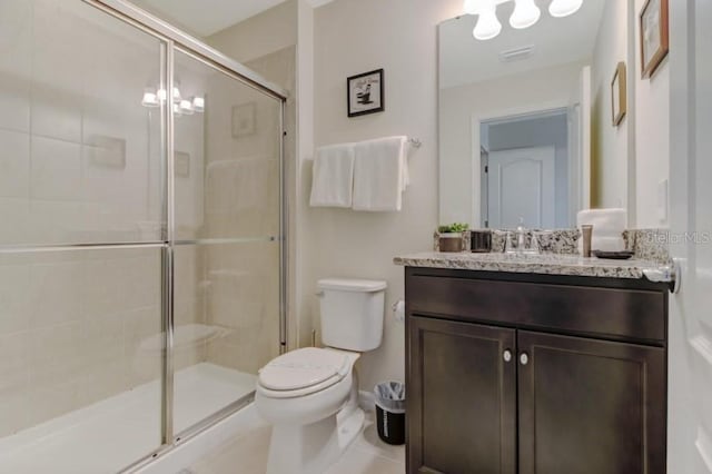 bathroom featuring walk in shower, toilet, tile floors, and vanity