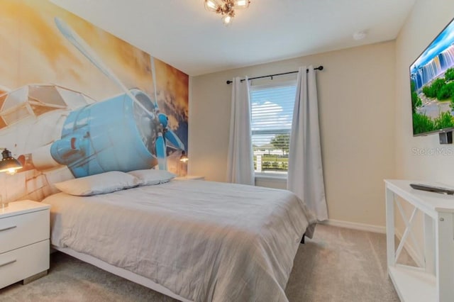 bedroom featuring light carpet