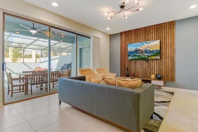 tiled living room featuring ceiling fan