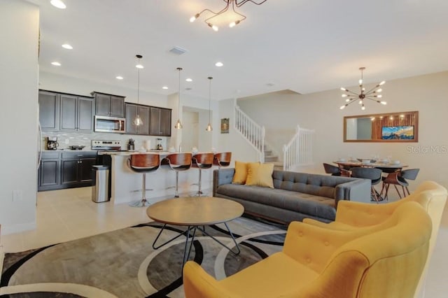 tiled living room with an inviting chandelier