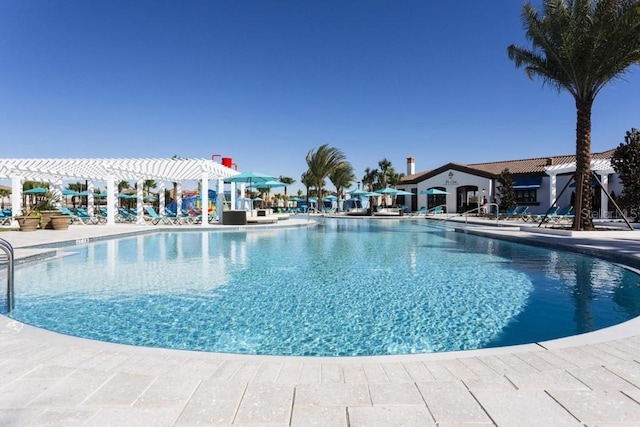 view of swimming pool featuring a pergola