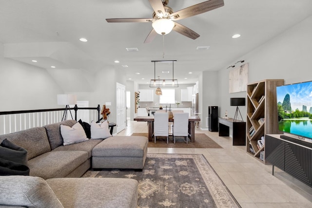 tiled living room with ceiling fan