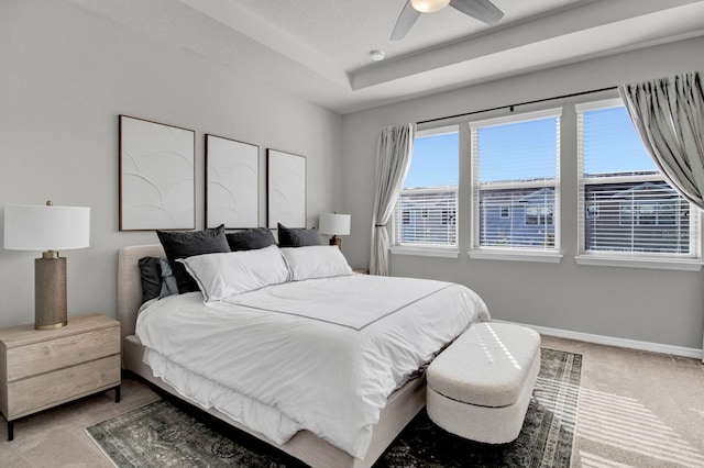 bedroom with multiple windows, ceiling fan, and carpet floors