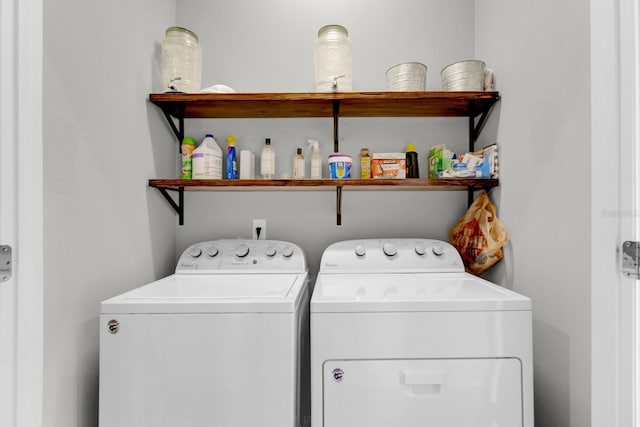 laundry area featuring washing machine and clothes dryer