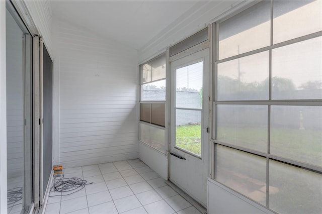 unfurnished sunroom with lofted ceiling